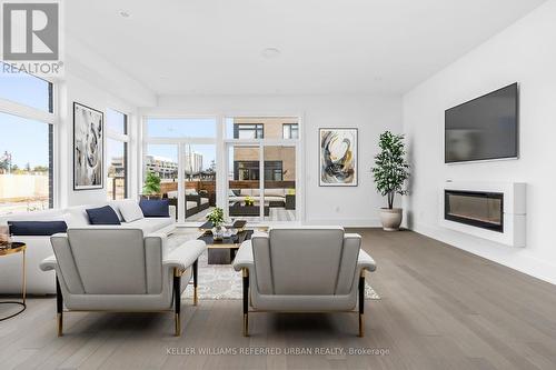 20 - 15 Lou Parsons Way, Mississauga, ON - Indoor Photo Showing Living Room With Fireplace