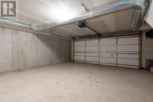 20 - 15 Lou Parsons Way, Mississauga, ON - Indoor Photo Showing Garage