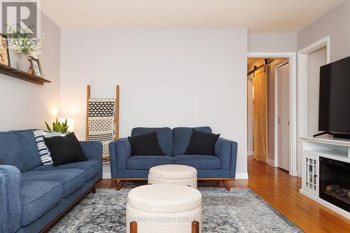 8 Roselyn Court, Kawartha Lakes (Lindsay), ON - Indoor Photo Showing Living Room With Fireplace