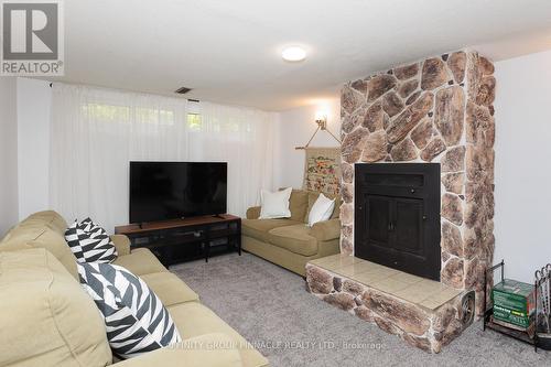 8 Roselyn Court, Kawartha Lakes (Lindsay), ON - Indoor Photo Showing Living Room With Fireplace