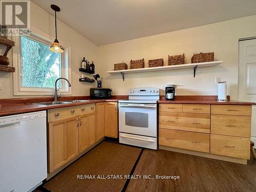 721 Hiawatha Line, Otonabee-South Monaghan, ON - Indoor Photo Showing Kitchen With Double Sink