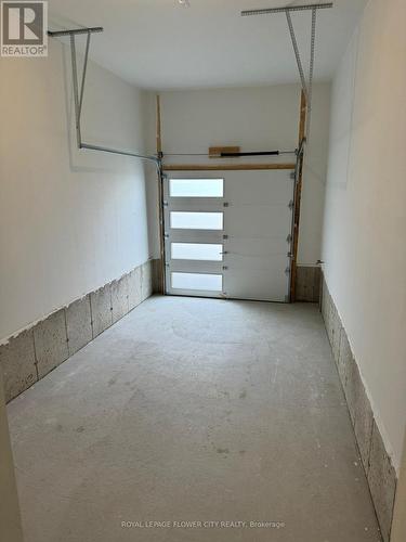 24 Mayapple Street, Adjala-Tosorontio, ON - Indoor Photo Showing Garage