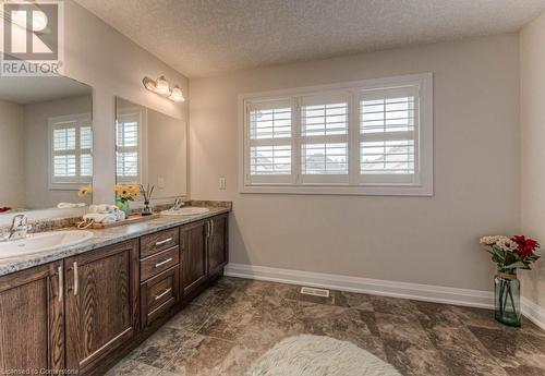 Bathroom featuring vanity and a textured ceiling - 14 Greyhawk Street, Kitchener, ON - Indoor Photo Showing Bathroom