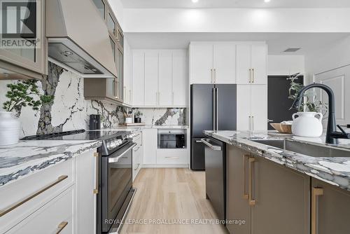 102 - 941 Charles Wilson Parkway, Cobourg, ON - Indoor Photo Showing Kitchen With Upgraded Kitchen