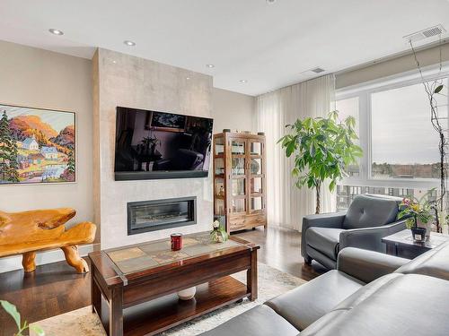 Salon - 601-305 Rue Carmelle-Boutin, Blainville, QC - Indoor Photo Showing Living Room With Fireplace