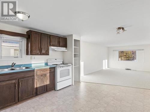 211-200 Lobird Road, Whitehorse, YT - Indoor Photo Showing Kitchen With Double Sink