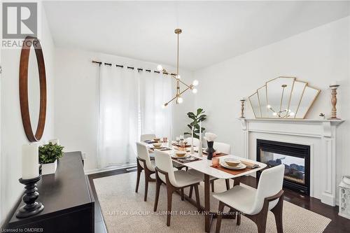 359 Nunn Court, Milton, ON - Indoor Photo Showing Dining Room With Fireplace