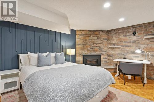 17 Strath Humber Court, Toronto, ON - Indoor Photo Showing Bedroom With Fireplace