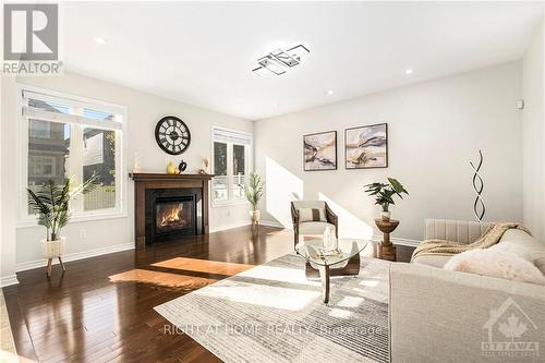 2212 Sunset Cove Circle, Ottawa, ON - Indoor Photo Showing Living Room With Fireplace