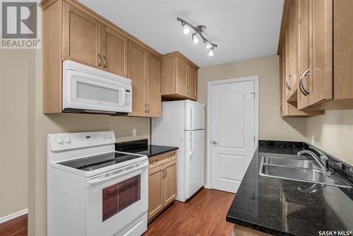 104F 1121 Mckercher Drive, Saskatoon, SK - Indoor Photo Showing Kitchen With Double Sink