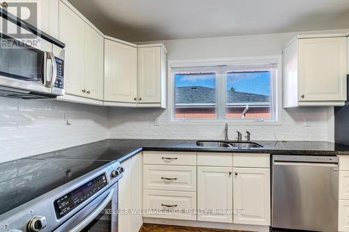 242 West 18Th Street, Hamilton, ON - Indoor Photo Showing Kitchen With Double Sink