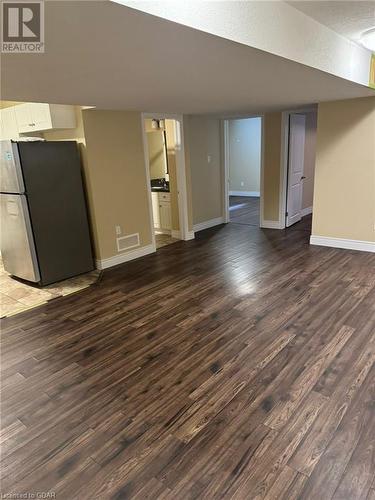 Unfurnished living room with dark hardwood / wood-style floors - 111 Dallan Drive, Guelph, ON - Indoor Photo Showing Other Room