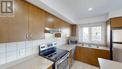 504 - 1440 Clarriage Court, Milton, ON - Indoor Photo Showing Kitchen With Stainless Steel Kitchen With Double Sink