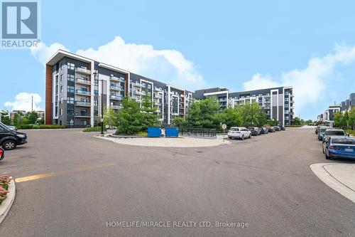 625 - 128 Grovewood Common, Oakville, ON - Outdoor With Balcony With Facade