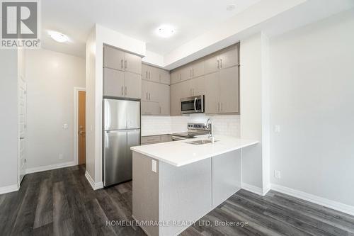 625 - 128 Grovewood Common, Oakville, ON - Indoor Photo Showing Kitchen With Stainless Steel Kitchen With Double Sink