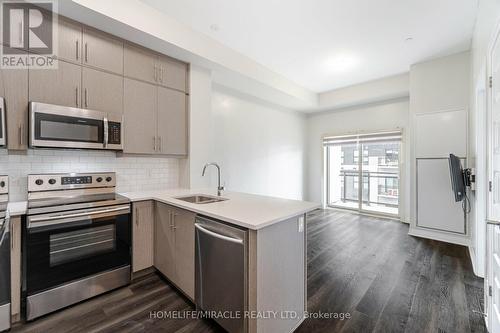 625 - 128 Grovewood Common, Oakville, ON - Indoor Photo Showing Kitchen With Stainless Steel Kitchen With Double Sink