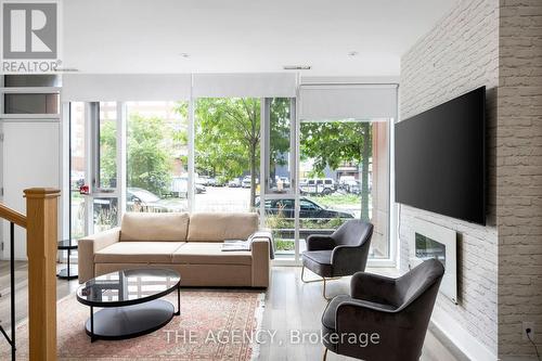 106 - 32 Davenport Road, Toronto, ON - Indoor Photo Showing Living Room With Fireplace