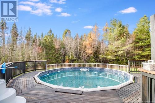 21 Katie Avenue, Douglas, NB - Outdoor With Above Ground Pool With Deck Patio Veranda With Backyard