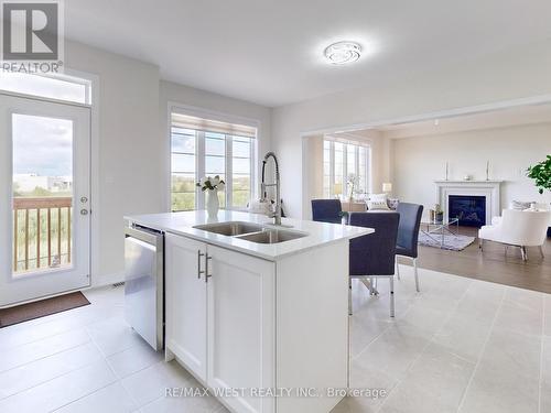 31 John Dallimore Drive, Georgina, ON - Indoor Photo Showing Kitchen With Fireplace With Double Sink