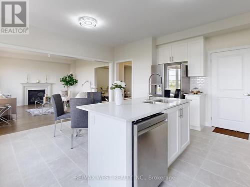 31 John Dallimore Drive, Georgina, ON - Indoor Photo Showing Kitchen With Fireplace With Double Sink