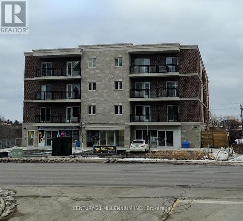 212 - 310 Broadway Avenue, Orangeville, ON - Outdoor With Balcony With Facade