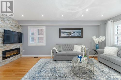 4 Delport Close, Brampton, ON - Indoor Photo Showing Living Room With Fireplace