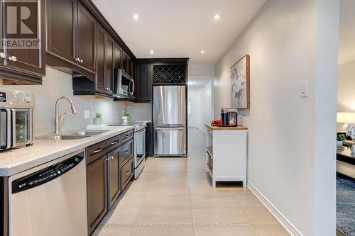 36 - 2355 Fifth Line W, Mississauga, ON - Indoor Photo Showing Kitchen With Stainless Steel Kitchen With Double Sink