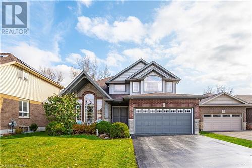 View of front of property with a front lawn - 43 Marr Drive, Elora, ON - Outdoor With Facade