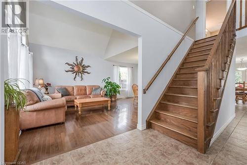 Staircase with hardwood / wood-style floors and lofted ceiling - 43 Marr Drive, Elora, ON - Indoor