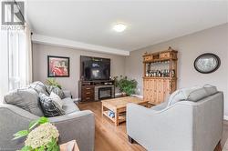 Living room featuring light wood-type flooring - 