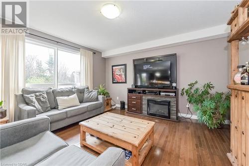 Living room with a fireplace and hardwood / wood-style flooring - 43 Marr Drive, Elora, ON - Indoor Photo Showing Living Room