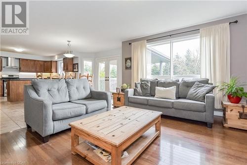 Living room featuring dark wood-type flooring and french doors - 43 Marr Drive, Elora, ON - Indoor Photo Showing Living Room