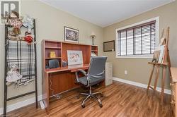 Office area featuring wood-type flooring - 