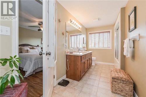 Bathroom featuring vanity, tile patterned floors, toilet, and ceiling fan - 43 Marr Drive, Elora, ON - Indoor