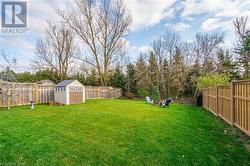 View of yard featuring a storage unit - 