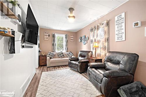 Living room with dark hardwood / wood-style flooring and crown molding - 97 William Street, Parry Sound, ON - Indoor Photo Showing Living Room