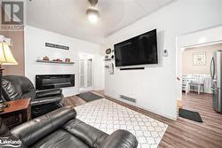 Living room featuring hardwood / wood-style floors - 