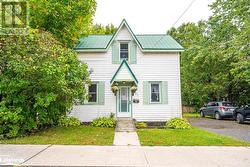 View of front of property with a front yard - 