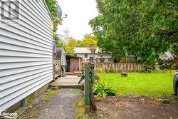 View of yard featuring a wooden deck - 