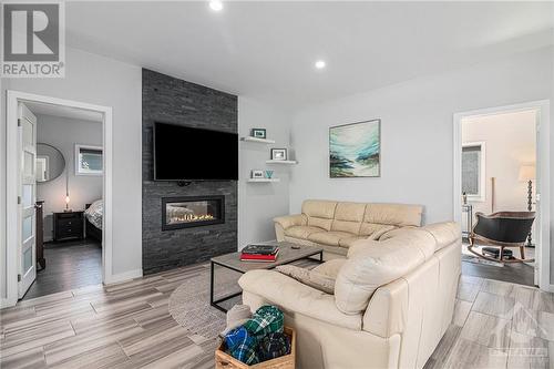 524 Voie Ferree Street, Hammond, ON - Indoor Photo Showing Living Room With Fireplace