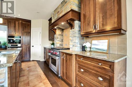 Exceptional appliances include Wolf, sub zero, Miele - 5844 Longhearth Way, Manotick, ON - Indoor Photo Showing Kitchen