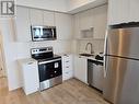 1907 - 202 Burnhamthorpe Road E, Mississauga, ON  - Indoor Photo Showing Kitchen With Upgraded Kitchen 