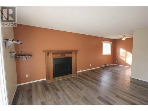 110 Skaha Place Unit# 303, Penticton, BC - Indoor Photo Showing Living Room With Fireplace