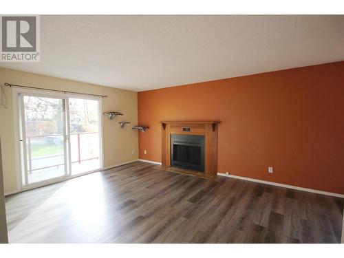 110 Skaha Place Unit# 303, Penticton, BC - Indoor Photo Showing Living Room With Fireplace