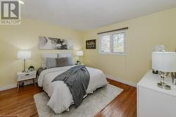 Bedroom with wood-type flooring - 