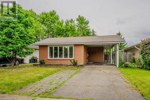 View of front of home featuring a front yard and a carport - 46 Appalachian Crescent, Kitchener, ON - Outdoor