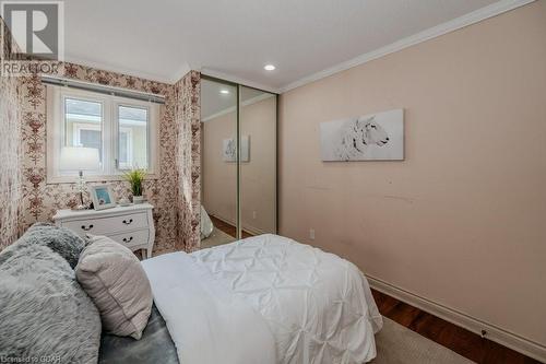 Bedroom featuring a closet, hardwood / wood-style floors, and crown molding - 46 Appalachian Crescent, Kitchener, ON - Indoor Photo Showing Bedroom