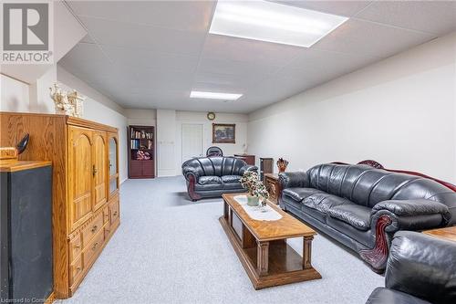 Living room featuring a drop ceiling and carpet - 46 Mark Place, Hamilton, ON 