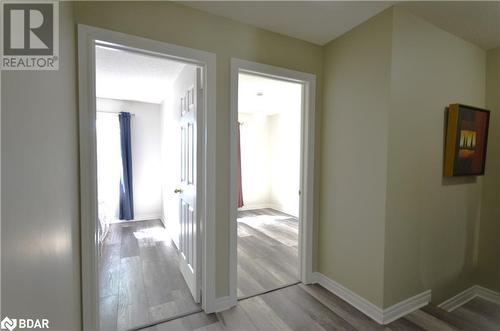 Corridor with light hardwood / wood-style floors - 175 Stanley Street Unit# 11, Barrie, ON - Indoor Photo Showing Other Room