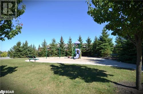 View of play area with a lawn - 175 Stanley Street Unit# 11, Barrie, ON - Outdoor